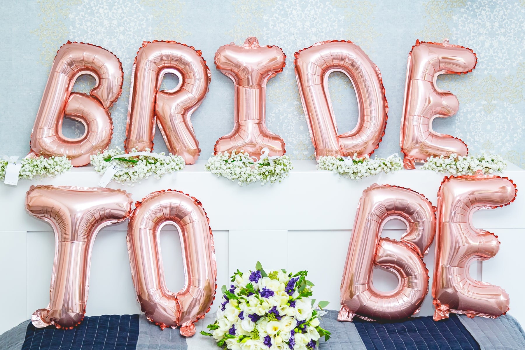 Pink letter balloons that spell out ‘BRIDE TO BE’.