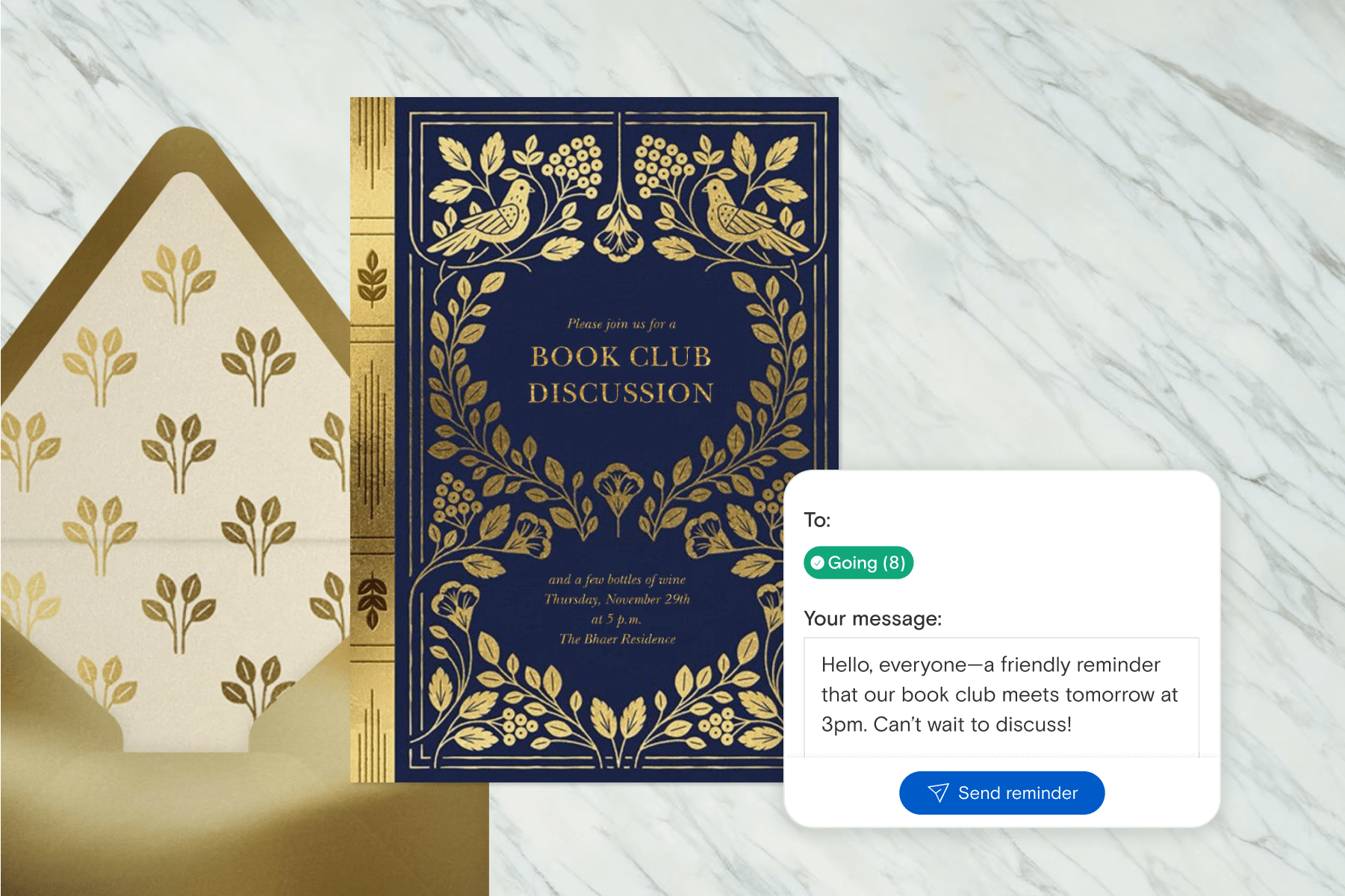 A dark blue book club invitation with an ornate frame of gold foil leaves and birds, with a gold envelope and an event reminder being sent as a Guest Message, in front of a white marble backdrop. 