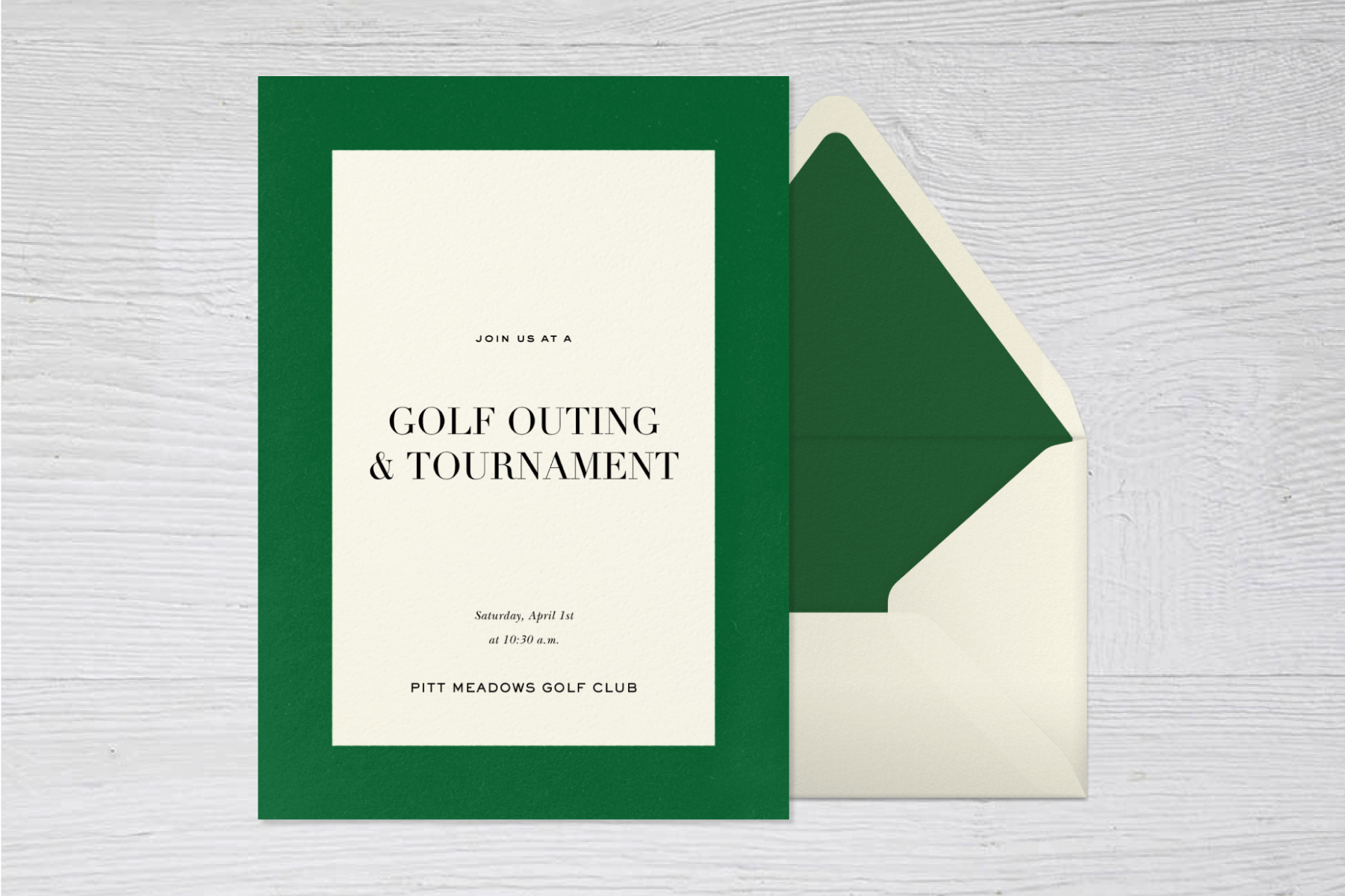 An invitation for a golf tournament with a wide green border beside a white envelope with green liner.
