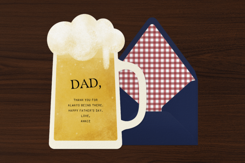 A card shaped like a foaming beer glass with a navy blue envelope with red plaid lining.
