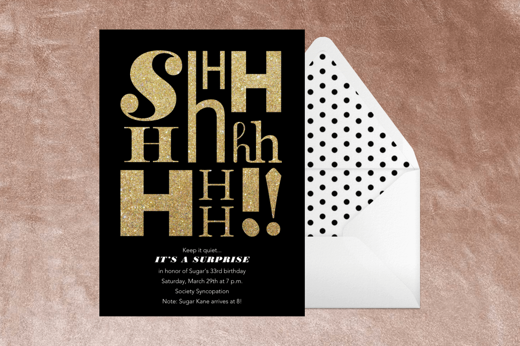 A black invitation with the letters SHHHHHHH!! in gold beside an envelope with polka dot liner.