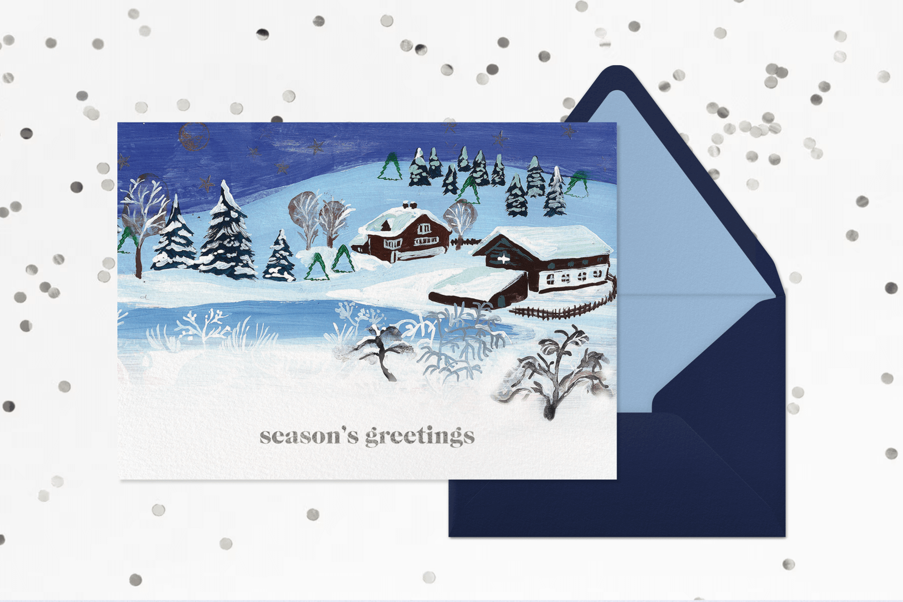 Illustrated card of two snow covered homes in the middle of a forest reading season’s greetings.