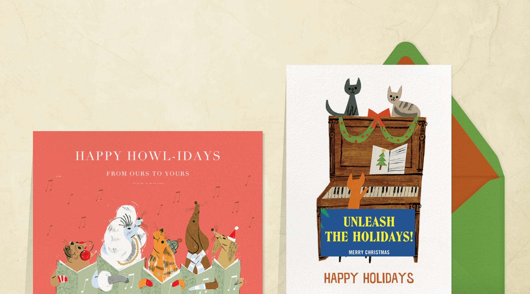 Red holiday card with caroling dogs next to a card with Cats on top of and playing a wreathed a piano