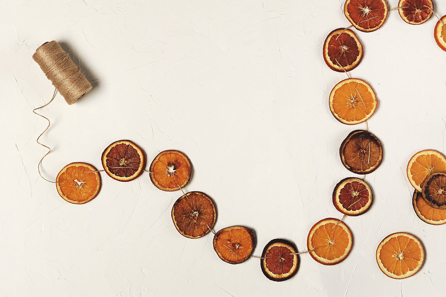 A citrus garland made of oranges and blood oranges.