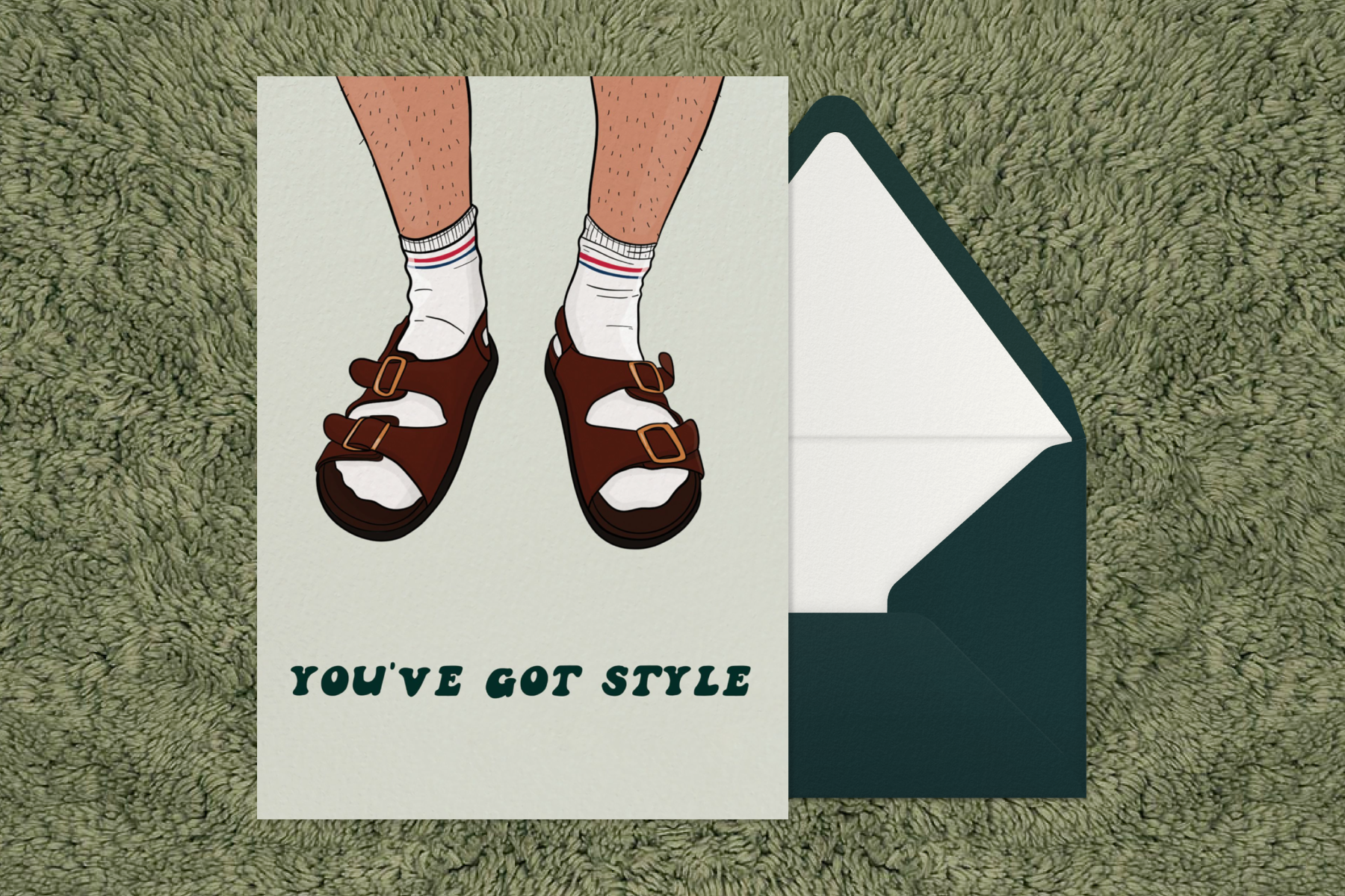 A Father’s Day card that reads ‘You’ve got style’ and an illustration of a man wearing socks with sandals next to a green envelope.